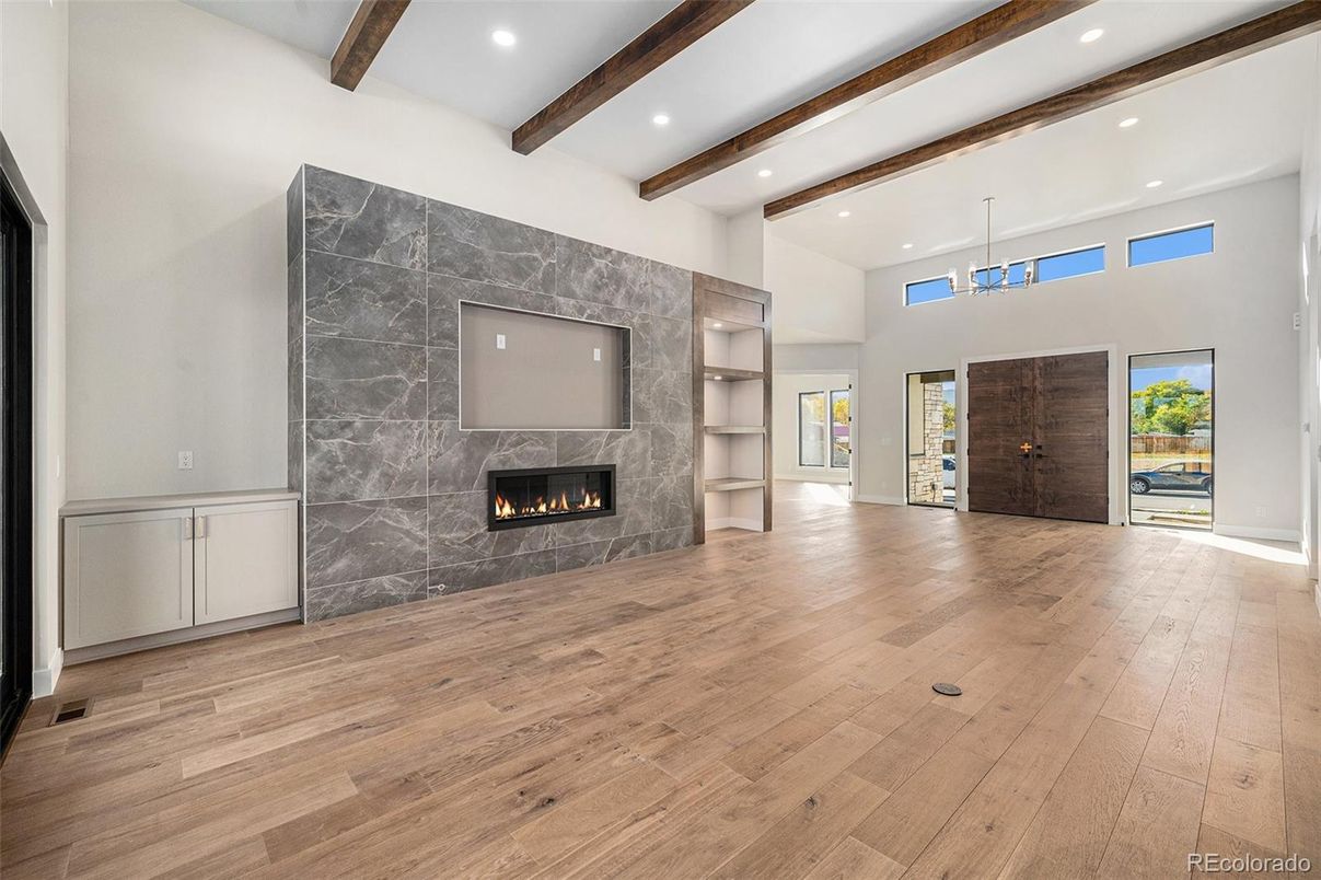 Empty room, Fireplace, Interior, Pendant Lights, Recessed Lighting, Wooden Beams, Wood Texture Flooring