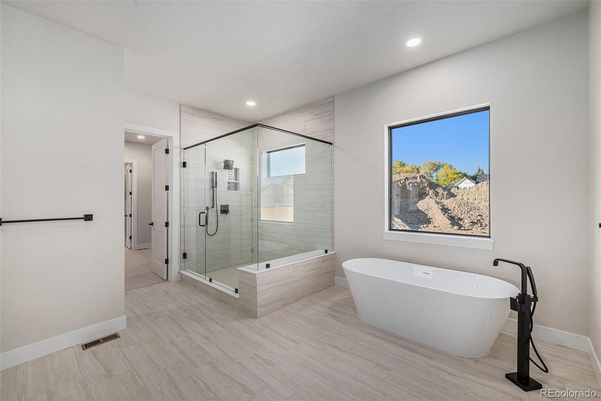 Bathroom, Free Standing Baths, Glass Shower, Interior, Recessed Lighting, Wood Texture Flooring