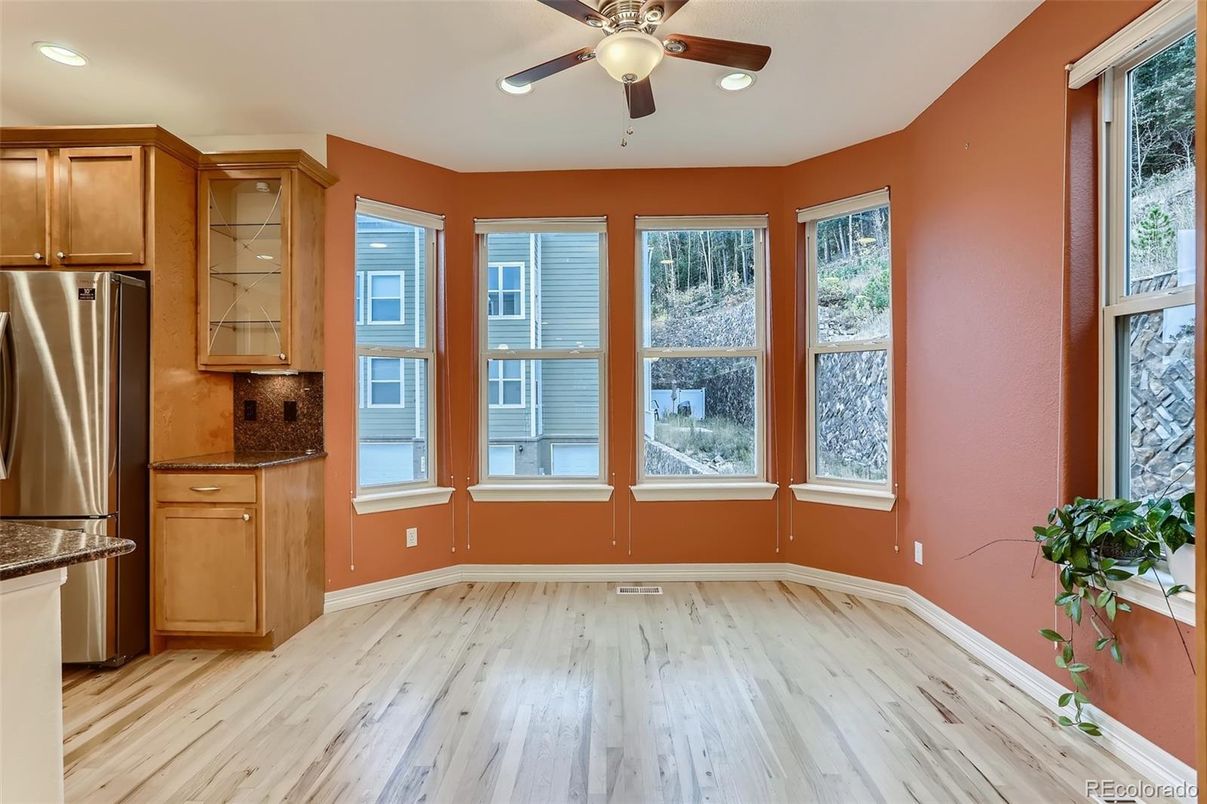 Empty room, Interior, Kitchen, Recessed Lighting, Stainless Steel Appliances, Wood Texture Flooring