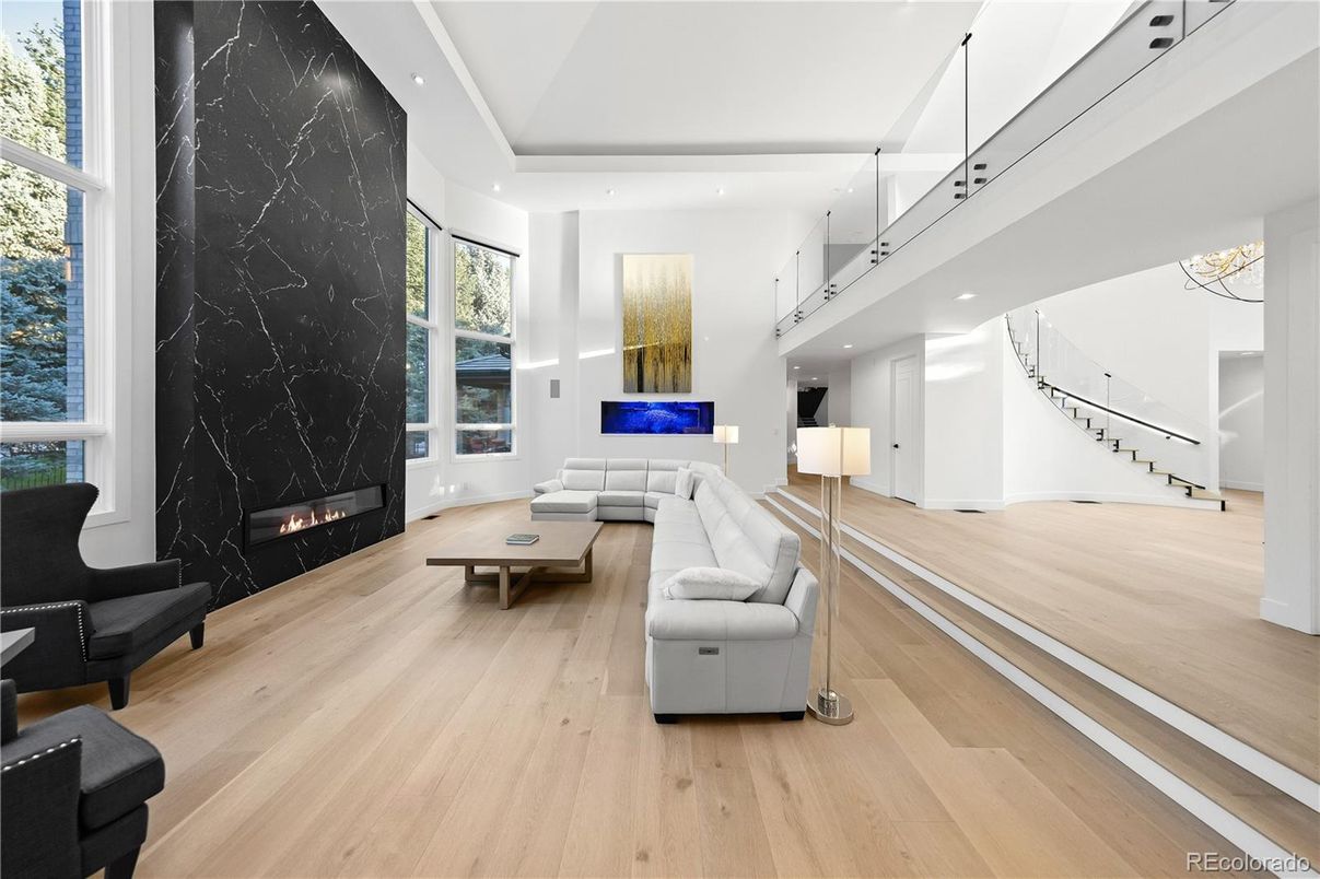 Fireplace, Interior, Living room, Marble Walls, Recessed Lighting, Wood Texture Flooring