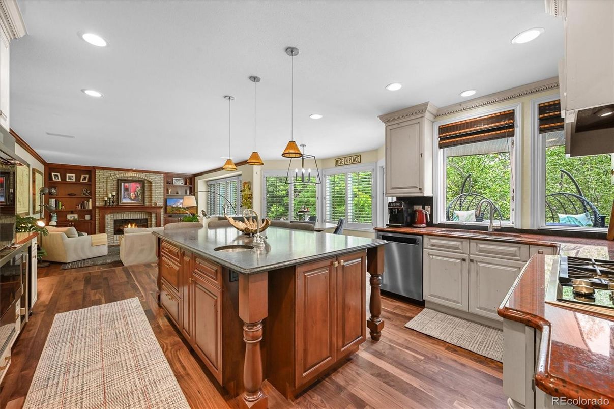 Dining room, Fireplace, Interior, Kitchen, Living room, Pendant Lights, Recessed Lighting, Stainless Steel Appliances, Wood Texture Flooring