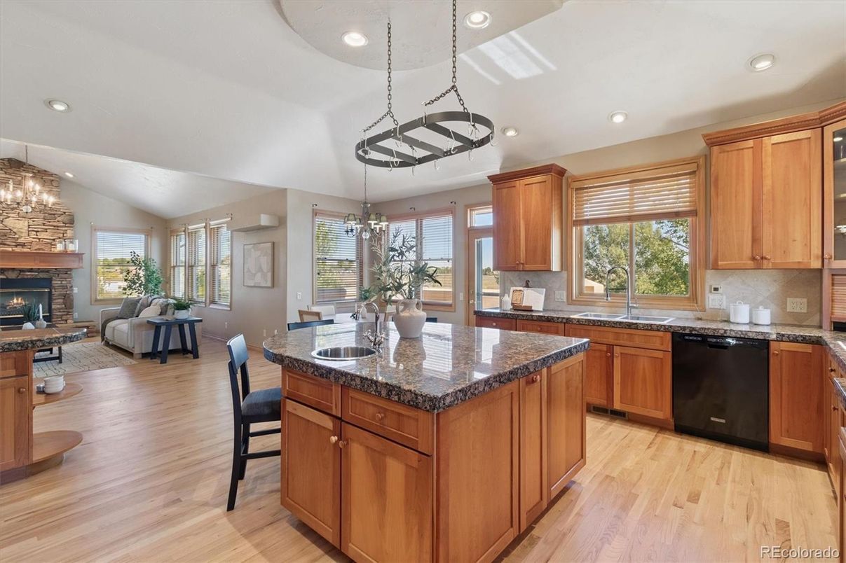 Chandelier, Dining room, Fireplace, Interior, Kitchen, Living room, Pendant Lights, Recessed Lighting, Wood Texture Flooring