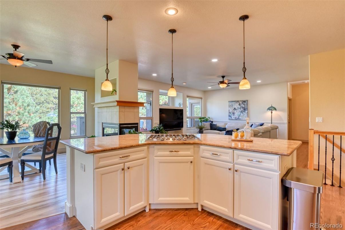 Dining room, Fireplace, Interior, Living room, Pendant Lights, Recessed Lighting, Wood Texture Flooring