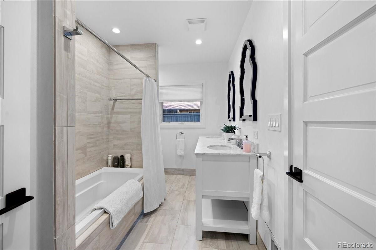 Bathroom, Dual Sink Vanities, Glass Shower, Interior, Recessed Lighting, Wood Texture Flooring