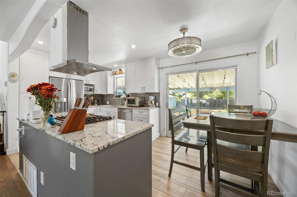 Dining room, Interior, Kitchen, Recessed Lighting, Stainless Steel Appliances, Wood Texture Flooring