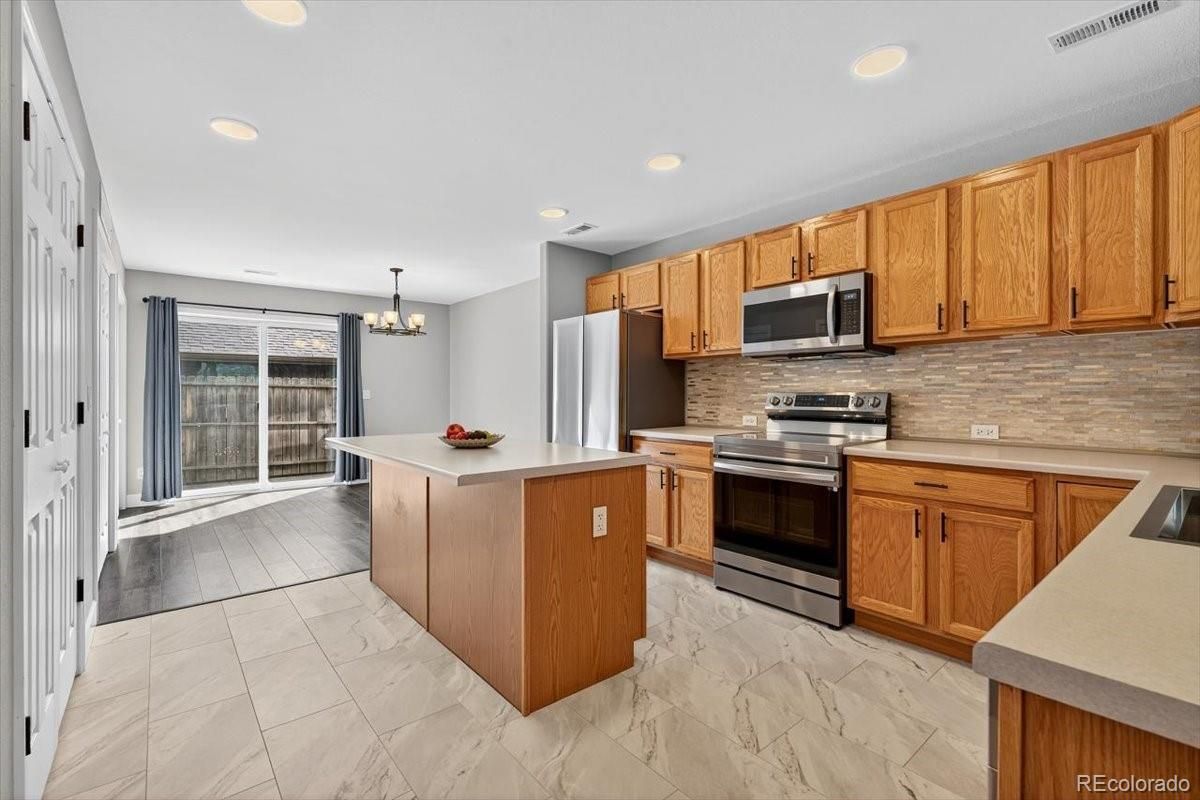 Chandelier, Dining room, Interior, Kitchen, Marble, Recessed Lighting, Stainless Steel Appliances, Wood Texture Flooring
