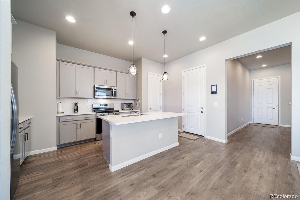 Interior, Kitchen, Pendant Lights, Recessed Lighting, Stainless Steel Appliances, Wood Texture Flooring