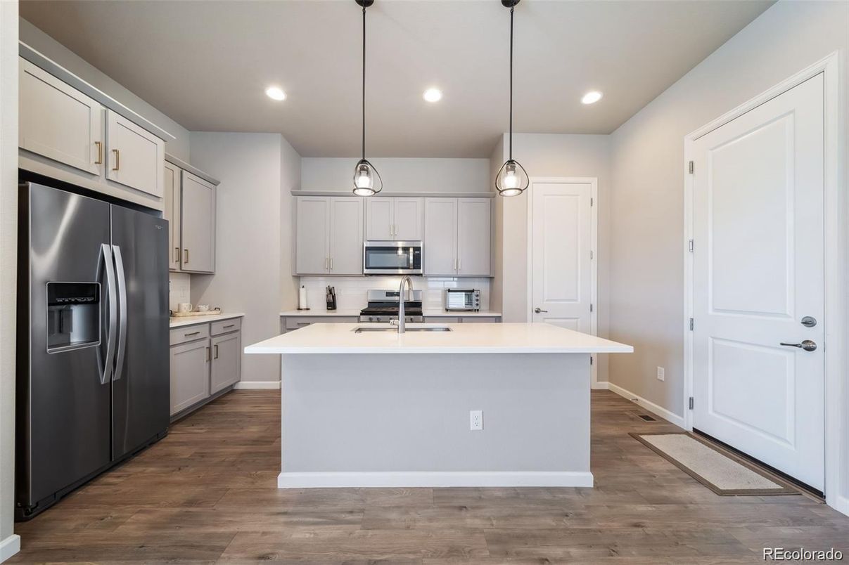 Interior, Kitchen, Pendant Lights, Recessed Lighting, Stainless Steel Appliances, Wood Texture Flooring