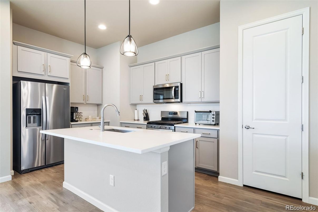 Interior, Kitchen, Pendant Lights, Recessed Lighting, Stainless Steel Appliances, Wood Texture Flooring