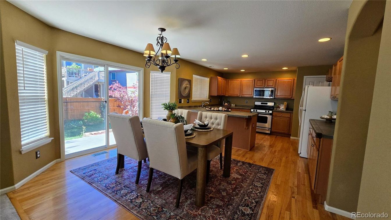 Chandelier, Dining room, Interior, Kitchen, Recessed Lighting, Stainless Steel Appliances, Wood Texture Flooring