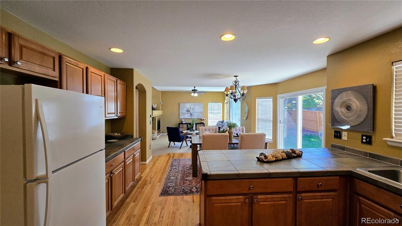 Chandelier, Dining room, Interior, Kitchen, Recessed Lighting, Tile Countertops, Wood Texture Flooring