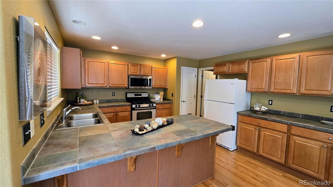 Interior, Kitchen, Recessed Lighting, Tile Countertops, Wood Texture Flooring