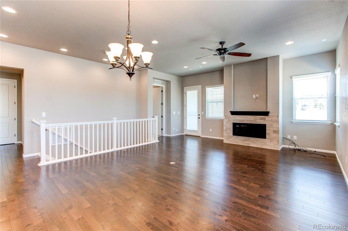 Chandelier, Empty room, Fireplace, Interior, Recessed Lighting, Wood Texture Flooring