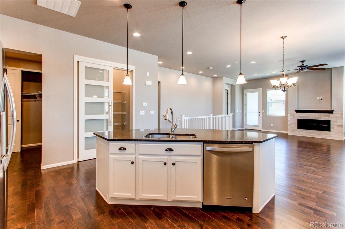 Fireplace, Interior, Kitchen, Pendant Lights, Recessed Lighting, Stainless Steel Appliances, Wood Texture Flooring