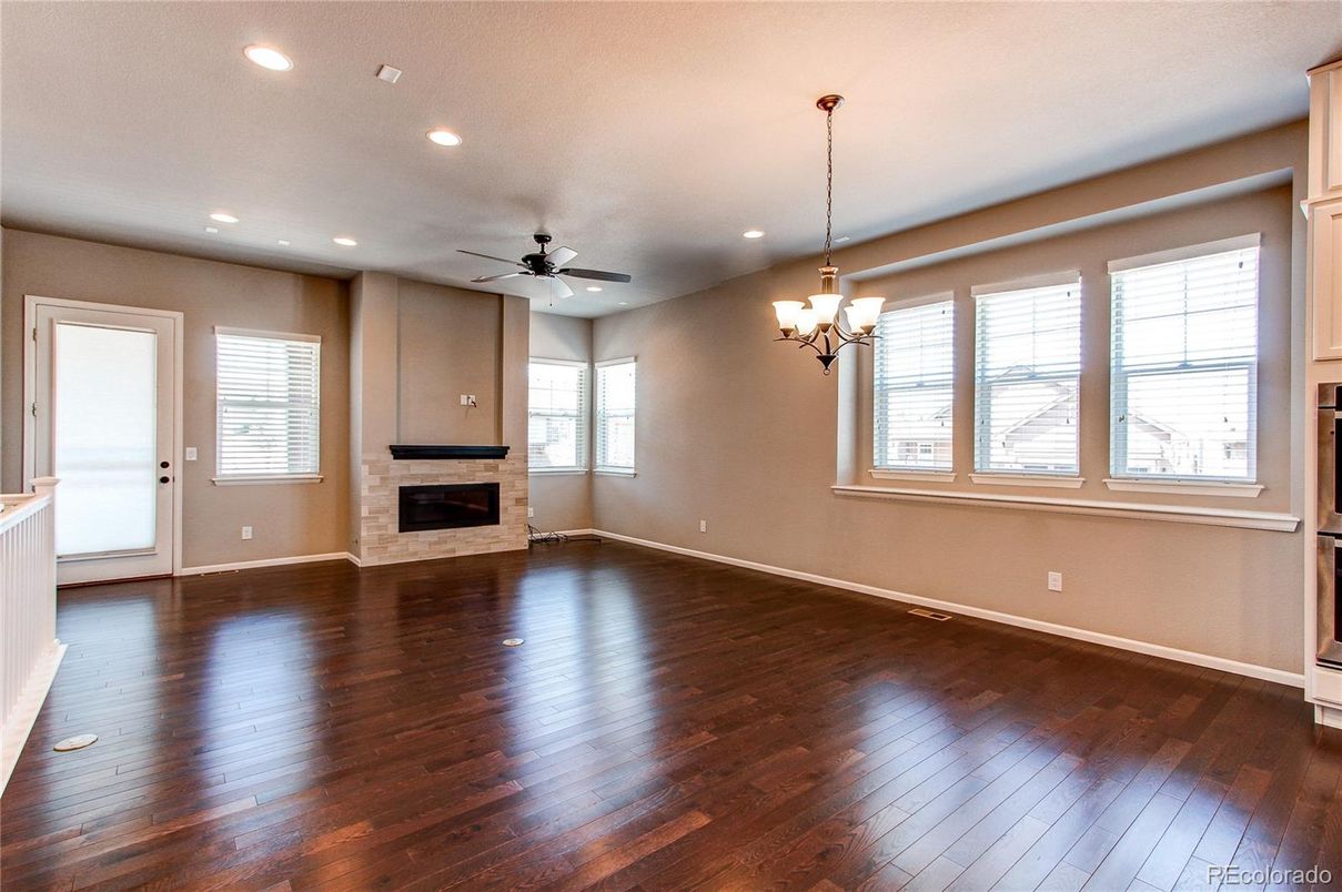 Chandelier, Empty room, Fireplace, Interior, Recessed Lighting, Wood Texture Flooring