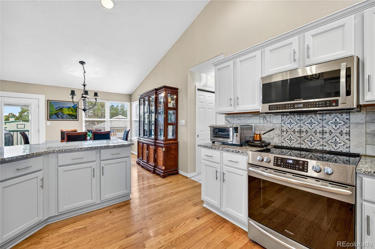 Chandelier, Interior, Kitchen, Pendant Lights, Stainless Steel Appliances, Wood Texture Flooring