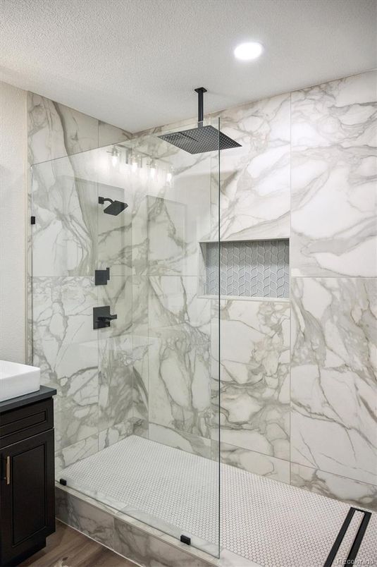 Bathroom, Glass Shower, Interior, Marble Walls, Recessed Lighting, Wood Texture Flooring