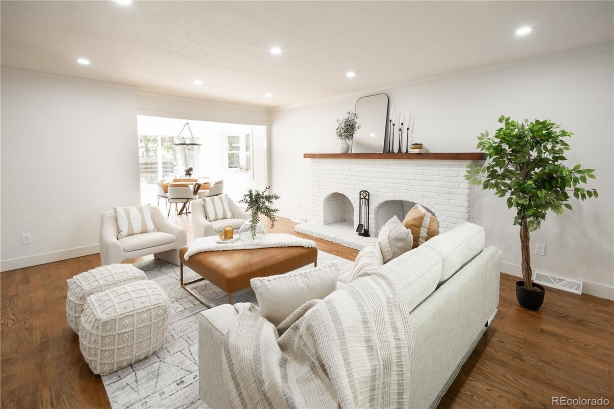 Dining room, Fireplace, Interior, Living room, Recessed Lighting, Stone Walls, Wood Texture Flooring