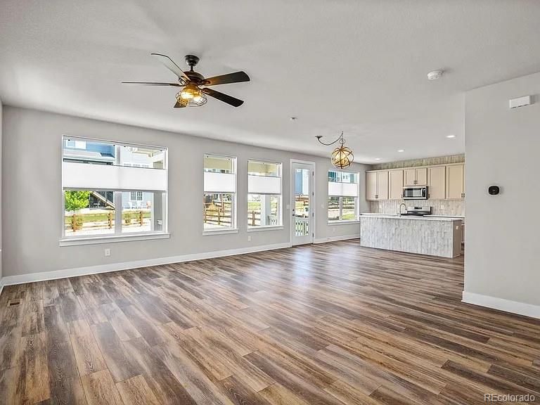 Chandelier, Empty room, Interior, Kitchen, Recessed Lighting, Stainless Steel Appliances, Wood Texture Flooring