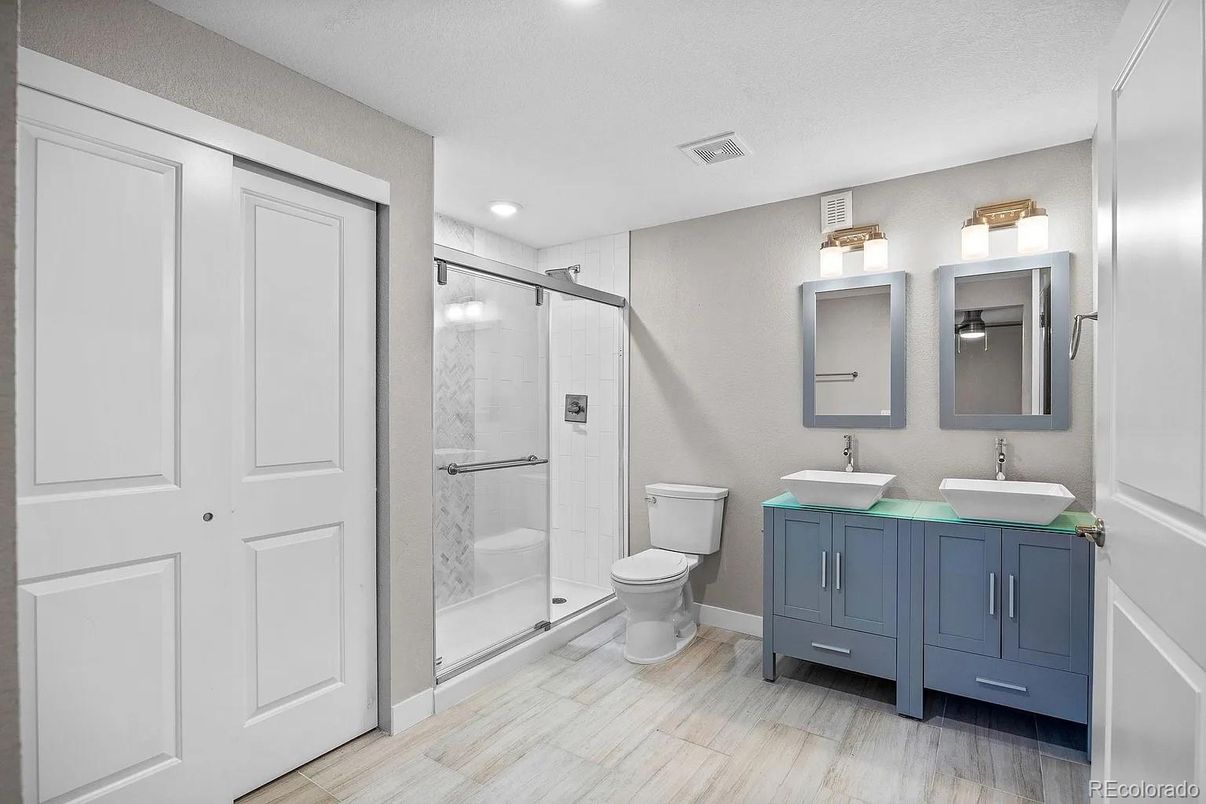 Bathroom, Dual Sink Vanities, Glass Shower, Interior, Recessed Lighting, Wood Texture Flooring