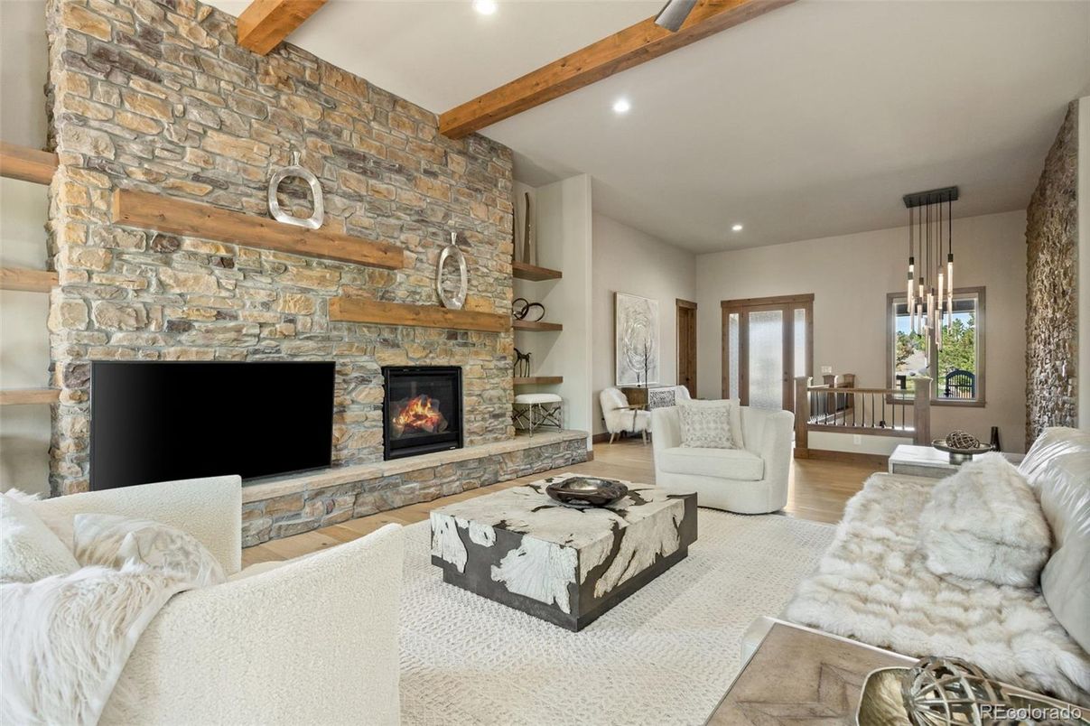 Fireplace, Interior, Living room, Pendant Lights, Recessed Lighting, Stone Walls, Wooden Beams, Wood Texture Flooring
