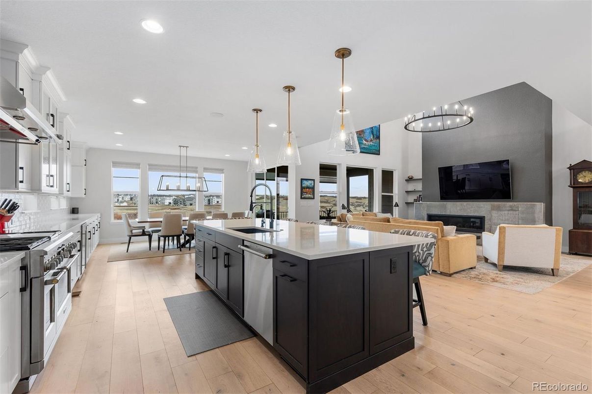 Dining room, Fireplace, Interior, Kitchen, Living room, Pendant Lights, Recessed Lighting, Stainless Steel Appliances, Wood Texture Flooring