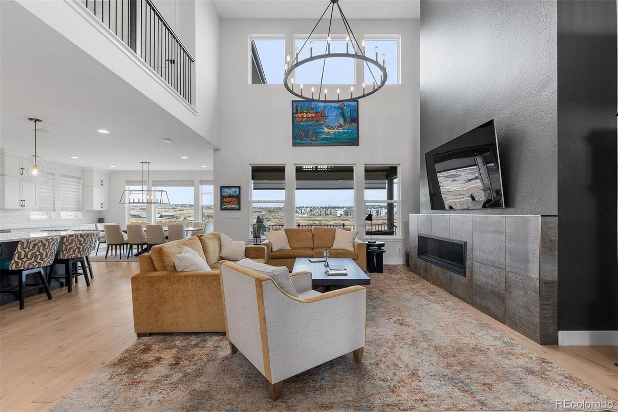 Chandelier, Dining room, Fireplace, Interior, Living room, Pendant Lights, Recessed Lighting, Wood Texture Flooring