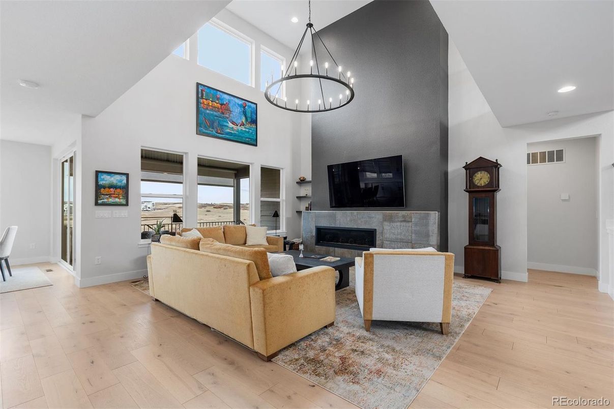 Chandelier, Fireplace, Interior, Living room, Pendant Lights, Recessed Lighting, Wood Texture Flooring
