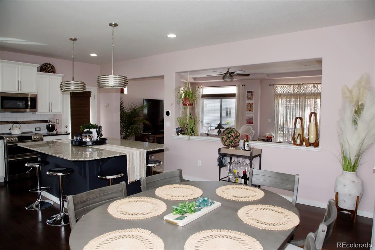 Dining room, Interior, Kitchen, Pendant Lights, Recessed Lighting, Stainless Steel Appliances, Wood Texture Flooring
