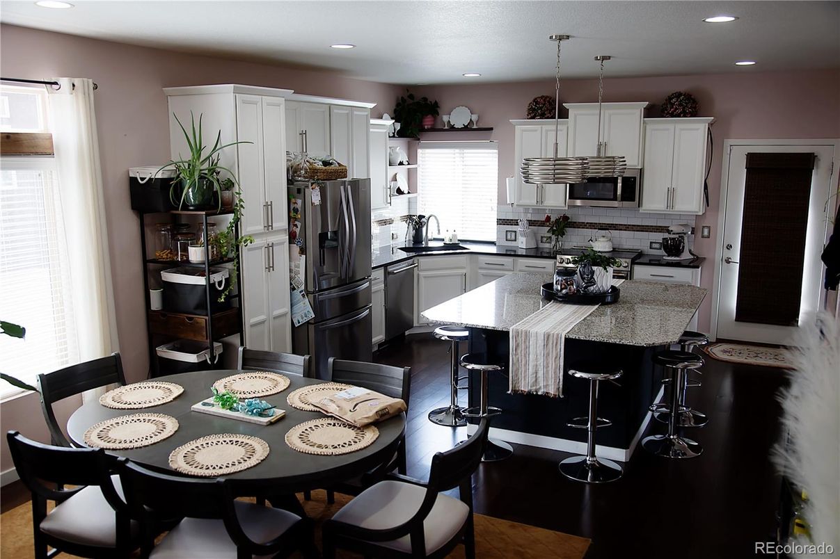 Dining room, Interior, Kitchen, Pendant Lights, Recessed Lighting, Stainless Steel Appliances, Wood Texture Flooring