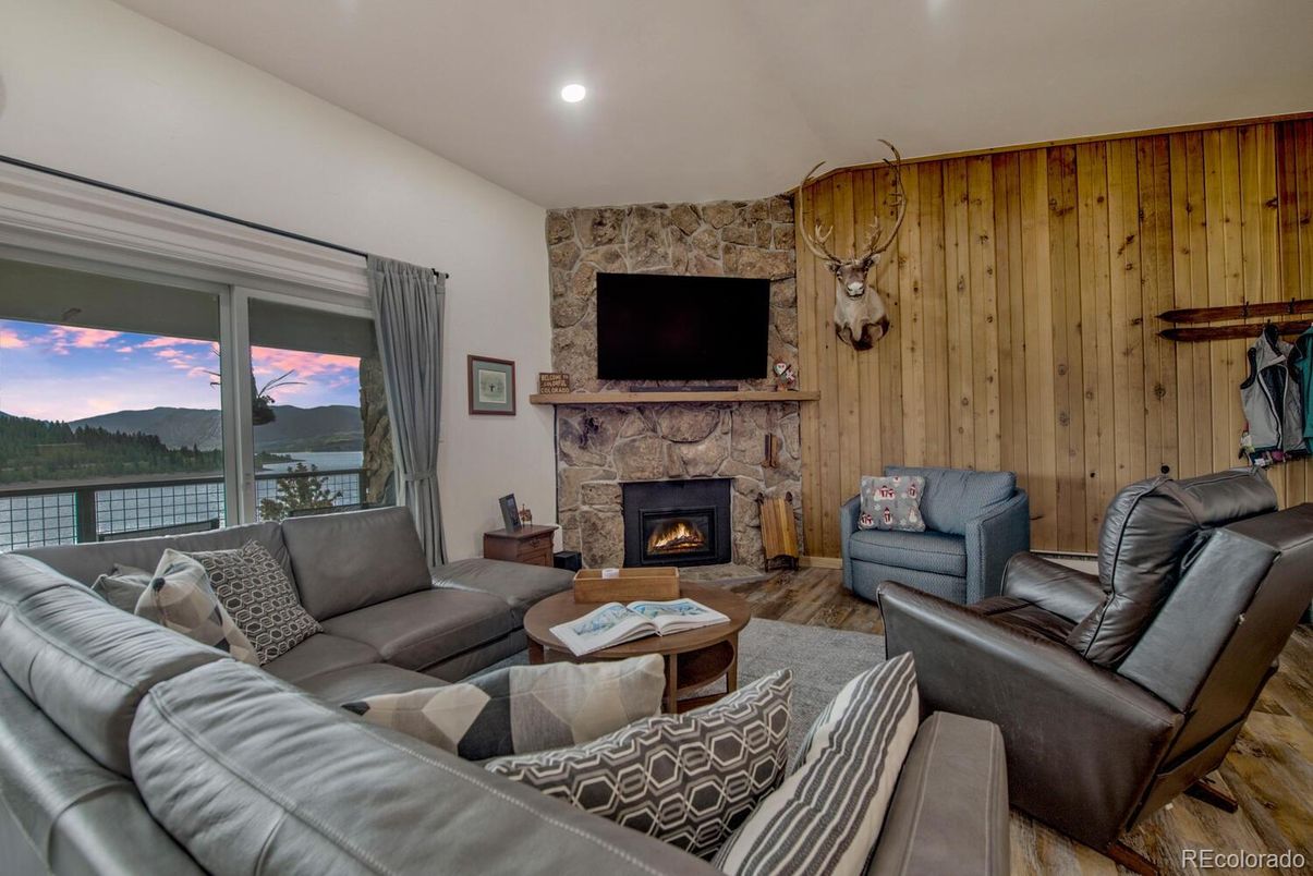 Fireplace, Interior, Living room, Recessed Lighting, Stone Walls, Water, Wooden Walls