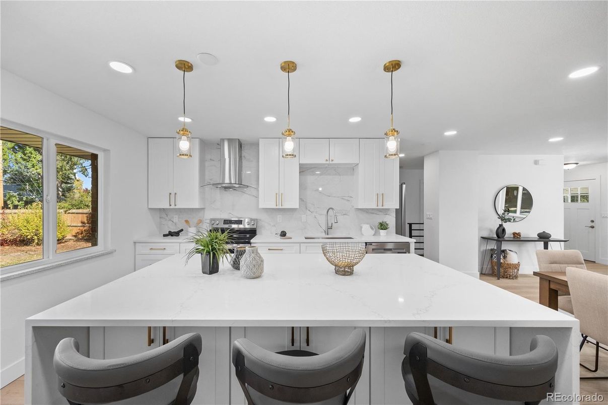 Interior, Kitchen, Marble Walls, Pendant Lights, Recessed Lighting, Stainless Steel Appliances, Wood Texture Flooring