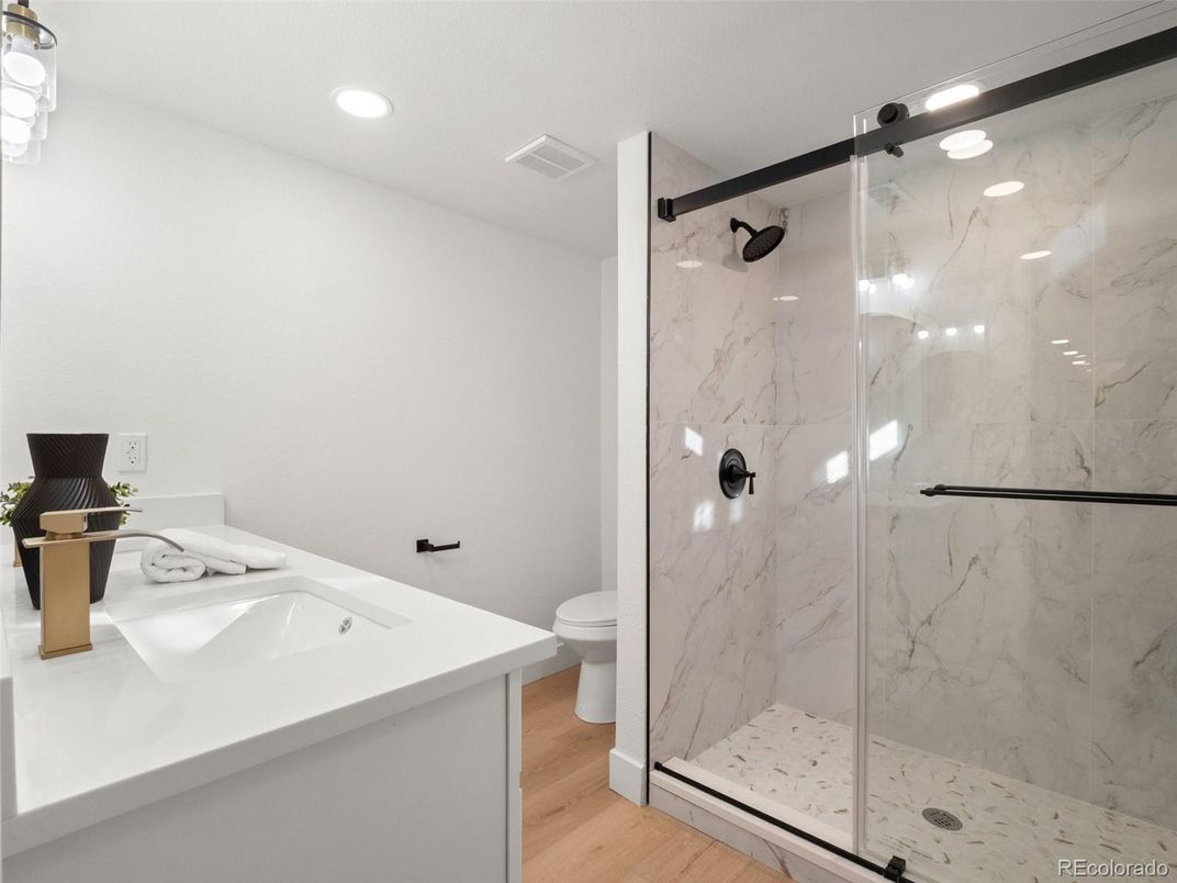 Bathroom, Glass Shower, Interior, Marble Walls, Recessed Lighting, Wood Texture Flooring