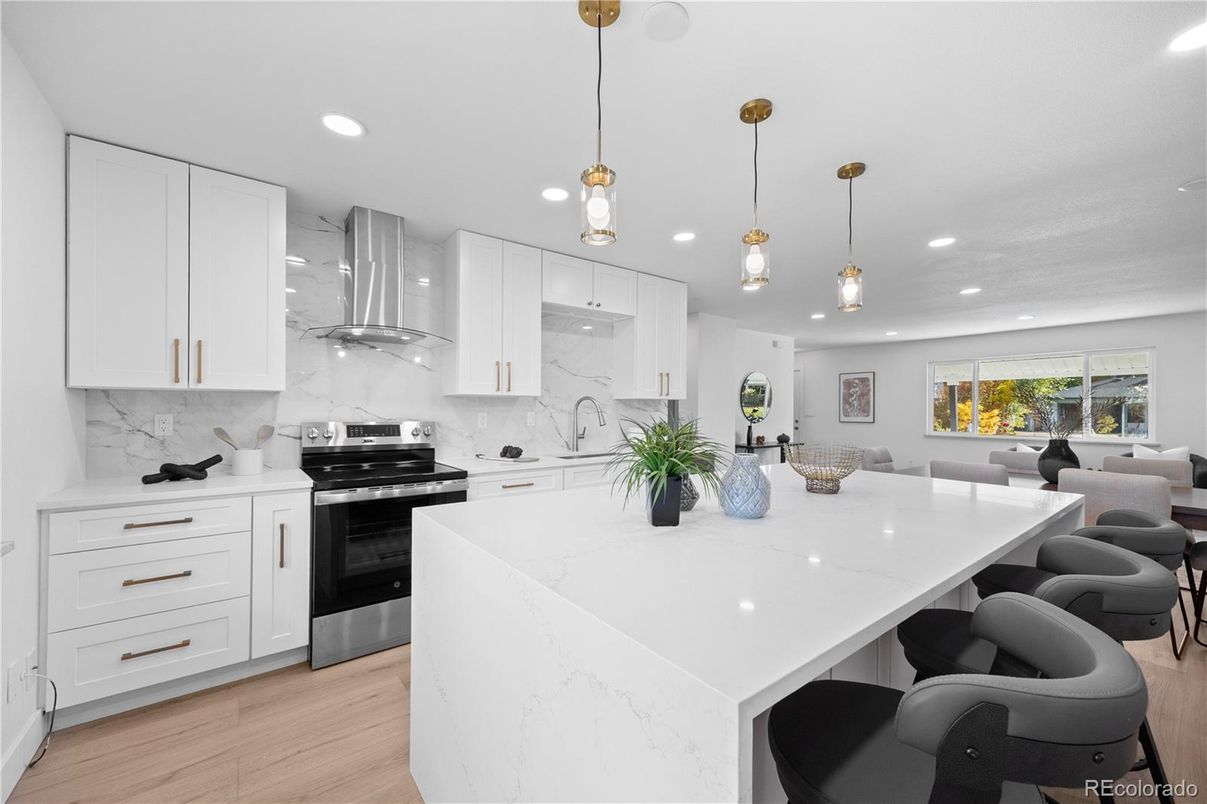 Interior, Kitchen, Marble Walls, Pendant Lights, Recessed Lighting, Stainless Steel Appliances, Wood Texture Flooring
