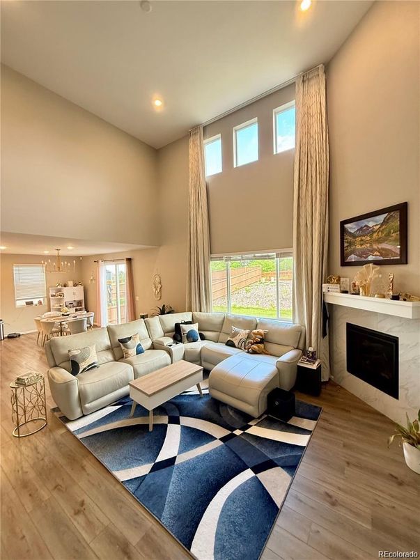 Dining room, Fireplace, Interior, Living room, Pendant Lights, Recessed Lighting, Wood Texture Flooring
