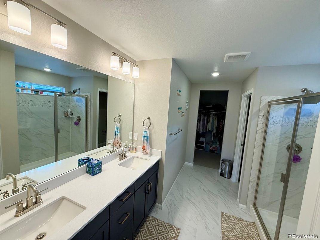 Bathroom, Dual Sink Vanities, Glass Shower, Interior, Marble, Recessed Lighting