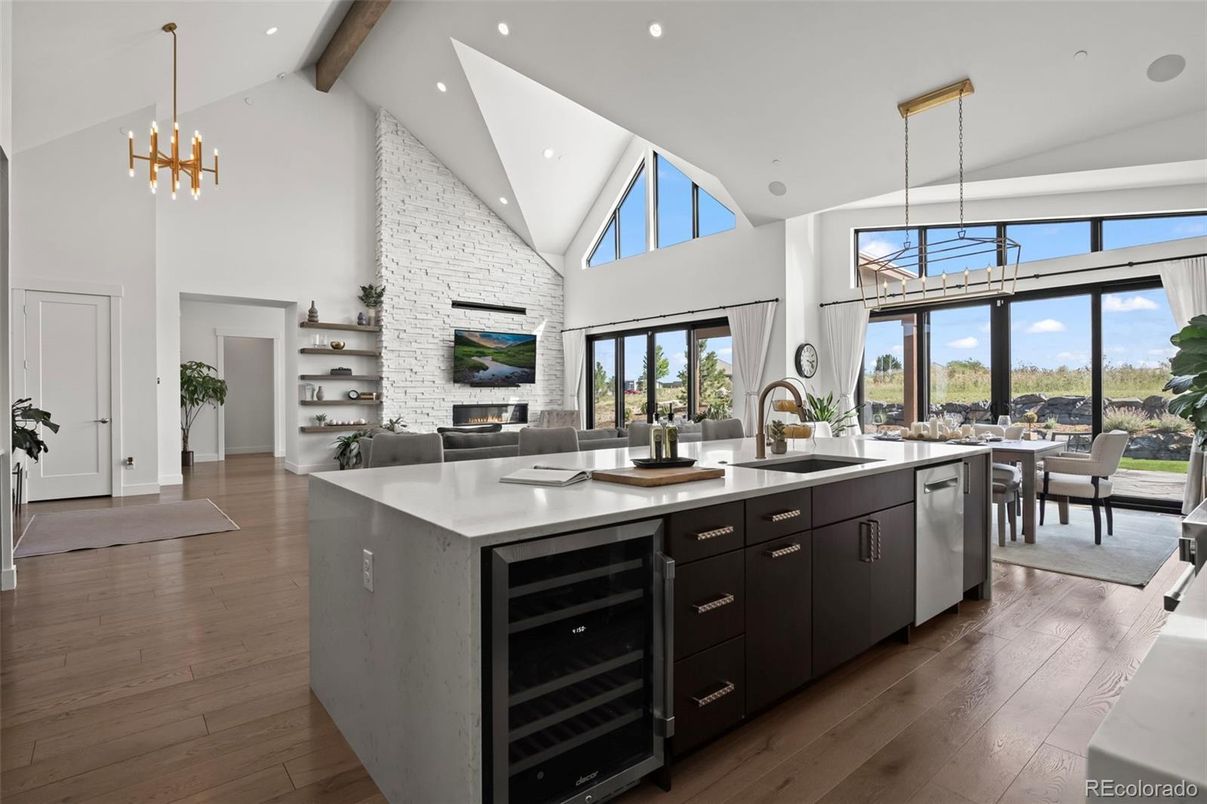 Dining room, Fireplace, Interior, Kitchen, Pendant Lights, Recessed Lighting, Stainless Steel Appliances, Stone Walls, Wooden Beams, Wood Texture Flooring