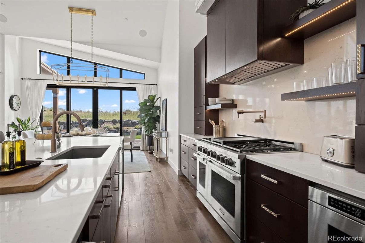 Dining room, Interior, Kitchen, Pendant Lights, Recessed Lighting, Stainless Steel Appliances, Wood Texture Flooring