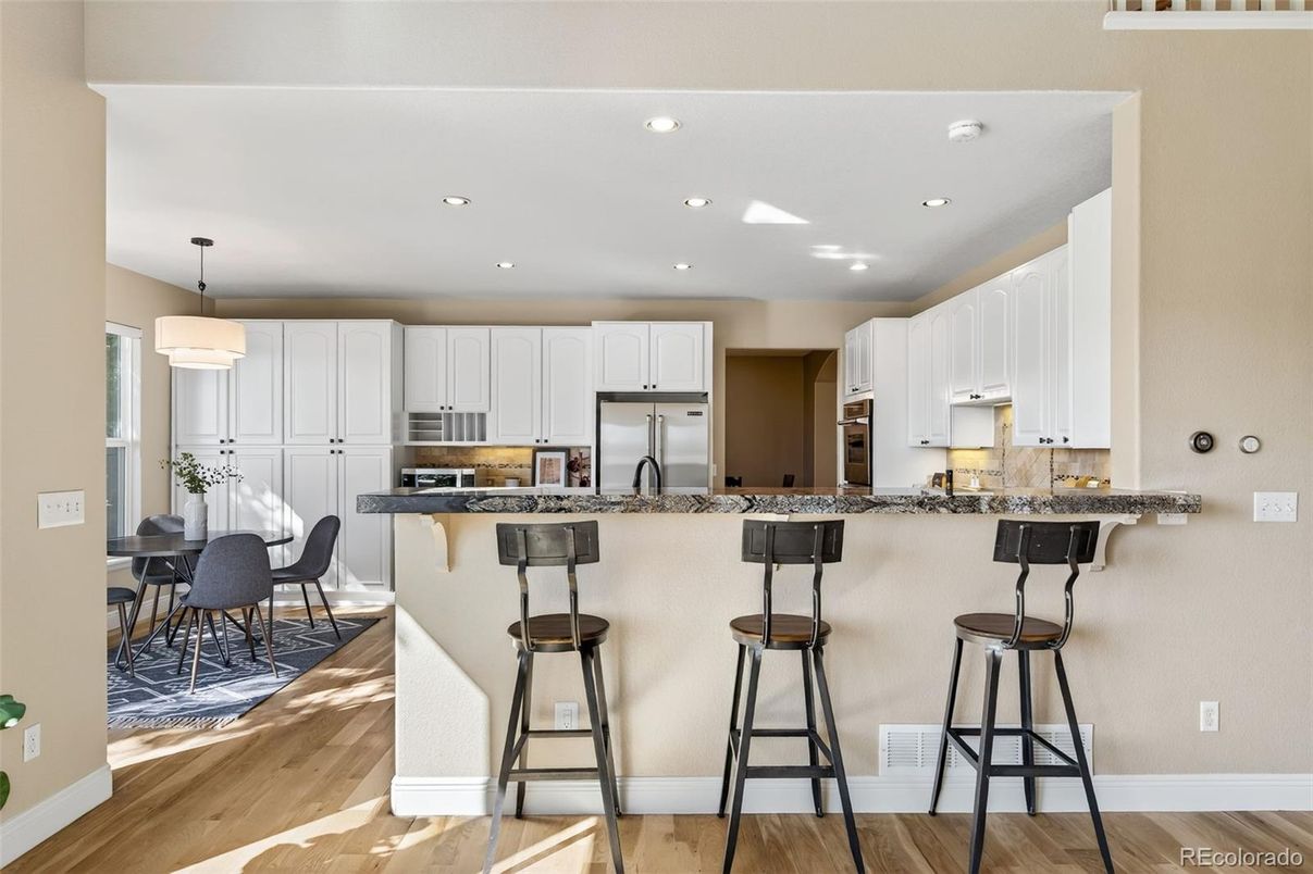 Dining room, Interior, Kitchen, Pendant Lights, Recessed Lighting, Stainless Steel Appliances, Wood Texture Flooring