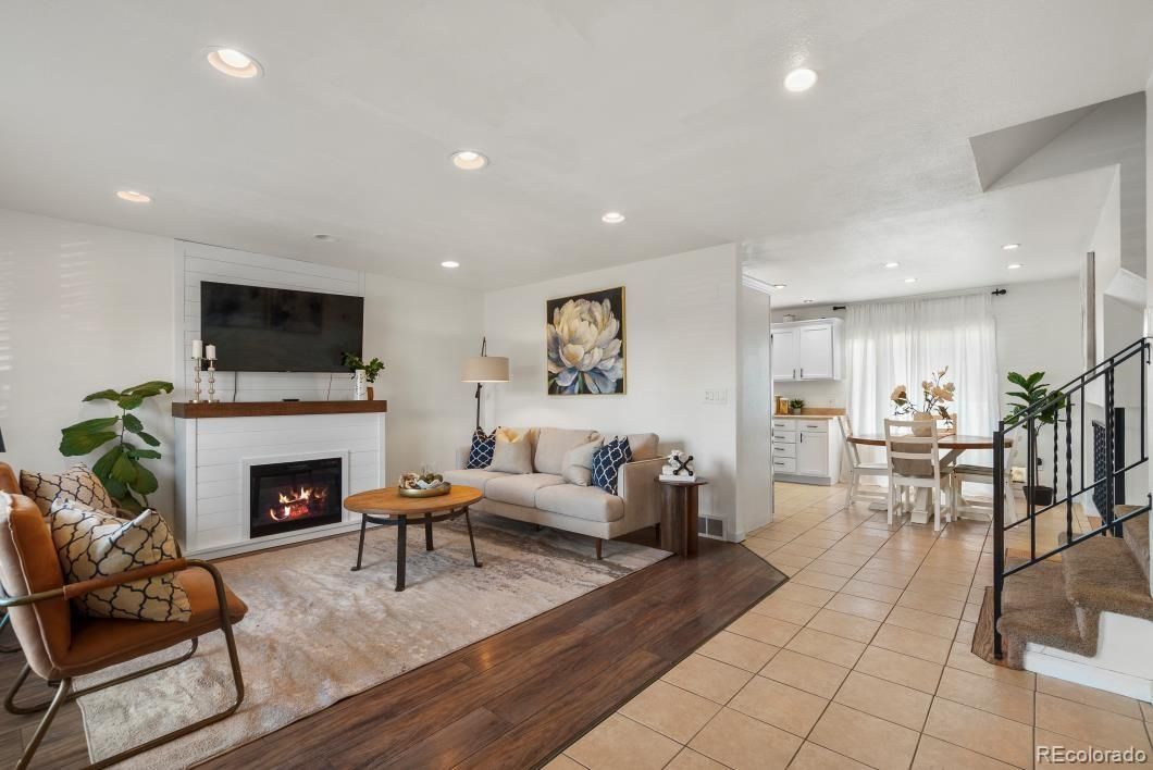 Dining room, Fireplace, Interior, Living room, Recessed Lighting, Wood Texture Flooring
