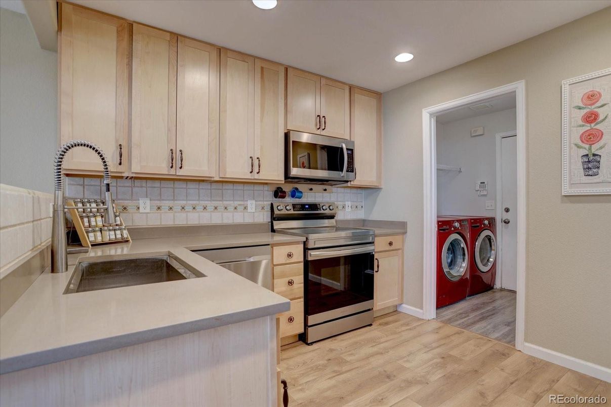 Interior, Kitchen, Recessed Lighting, Washer, Wood Texture Flooring