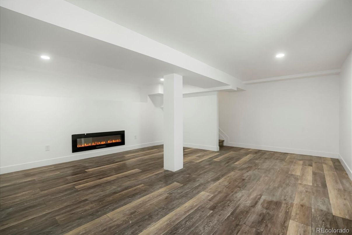 Empty room, Fireplace, Interior, Recessed Lighting, Wood Texture Flooring
