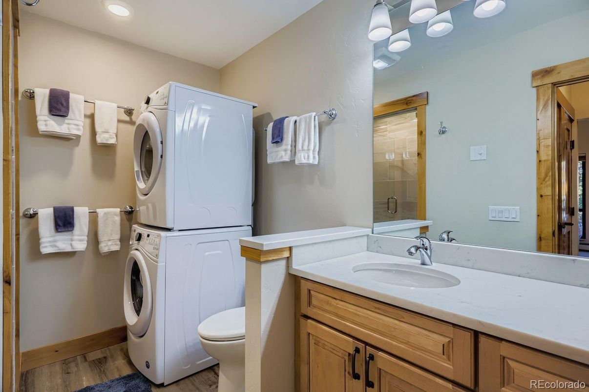 Bathroom, Interior, Recessed Lighting, Washer, Wood Texture Flooring
