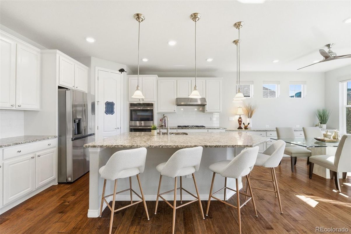 Dining room, Interior, Kitchen, Pendant Lights, Recessed Lighting, Stainless Steel Appliances, Wood Texture Flooring