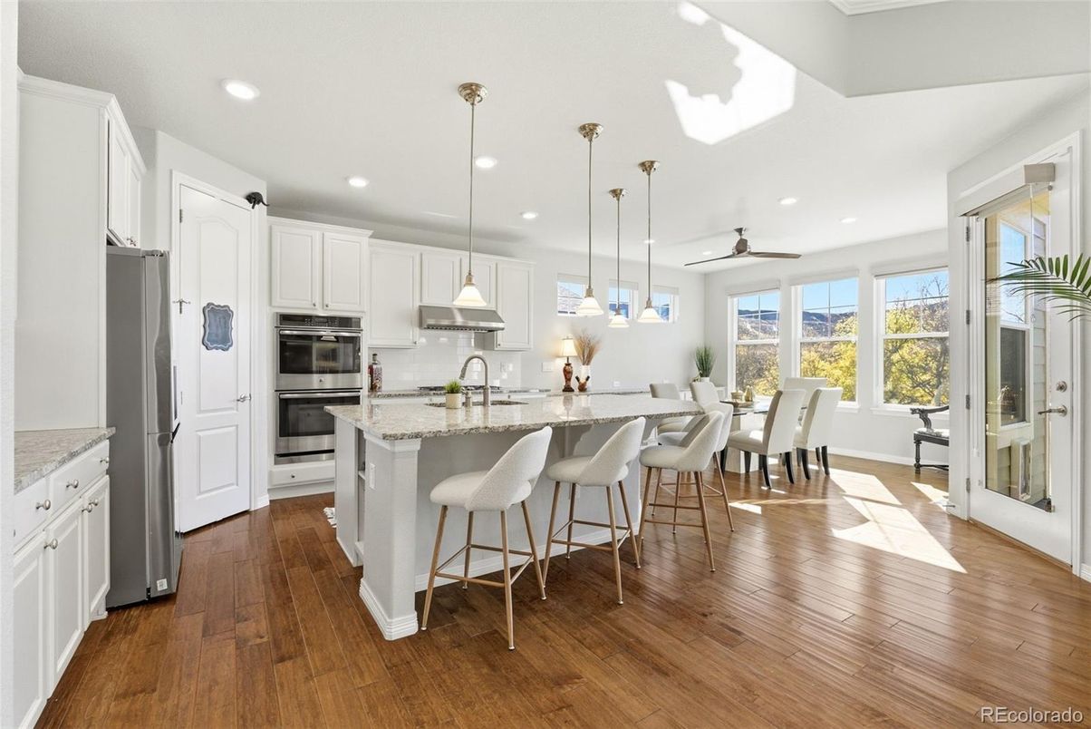 Dining room, Interior, Kitchen, Pendant Lights, Recessed Lighting, Stainless Steel Appliances, Wood Texture Flooring