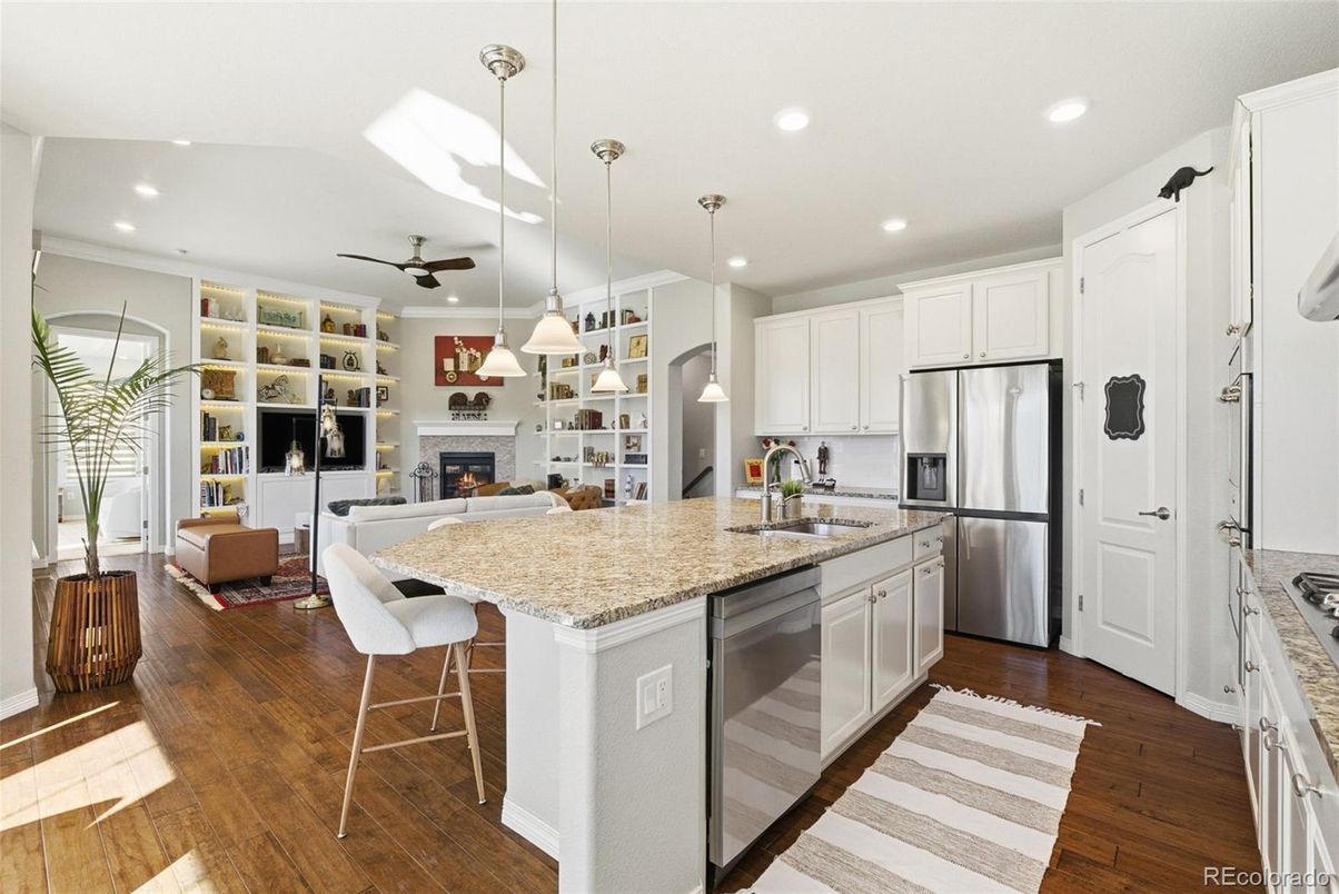 Fireplace, Interior, Kitchen, Living room, Pendant Lights, Recessed Lighting, Stainless Steel Appliances, Wood Texture Flooring