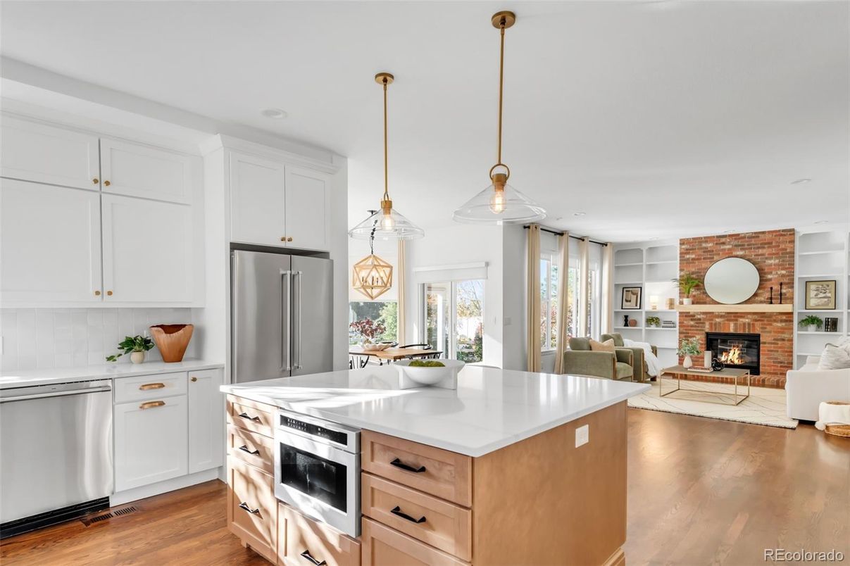 Dining room, Fireplace, Interior, Kitchen, Living room, Pendant Lights, Recessed Lighting, Stainless Steel Appliances, Stone Walls, Wood Texture Flooring