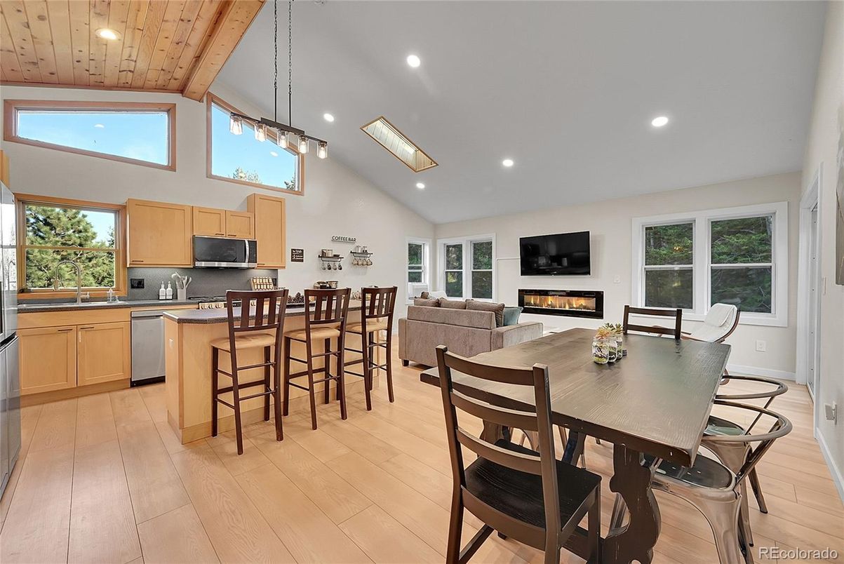 Dining room, Fireplace, Interior, Kitchen, Living room, Pendant Lights, Recessed Lighting, Wooden Ceilings, Wood Texture Flooring