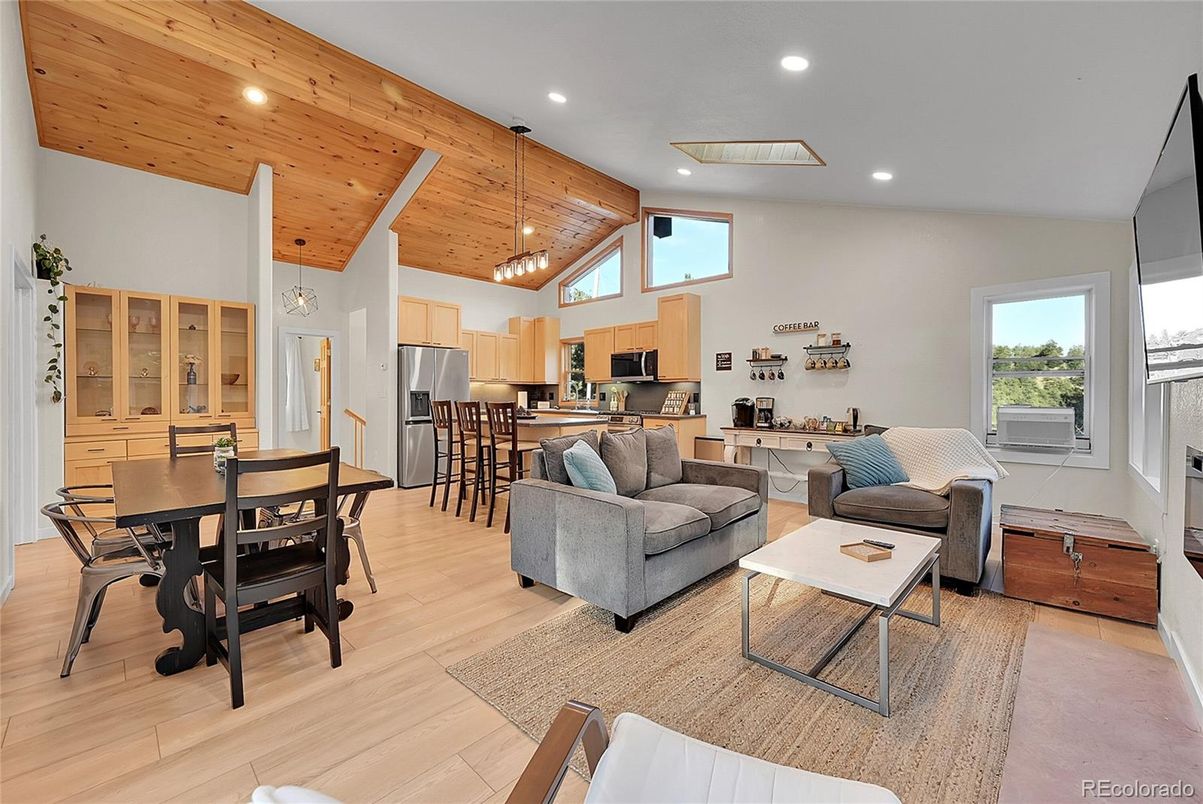 Dining room, Interior, Kitchen, Living room, Pendant Lights, Recessed Lighting, Stainless Steel Appliances, Wooden Ceilings, Wood Texture Flooring