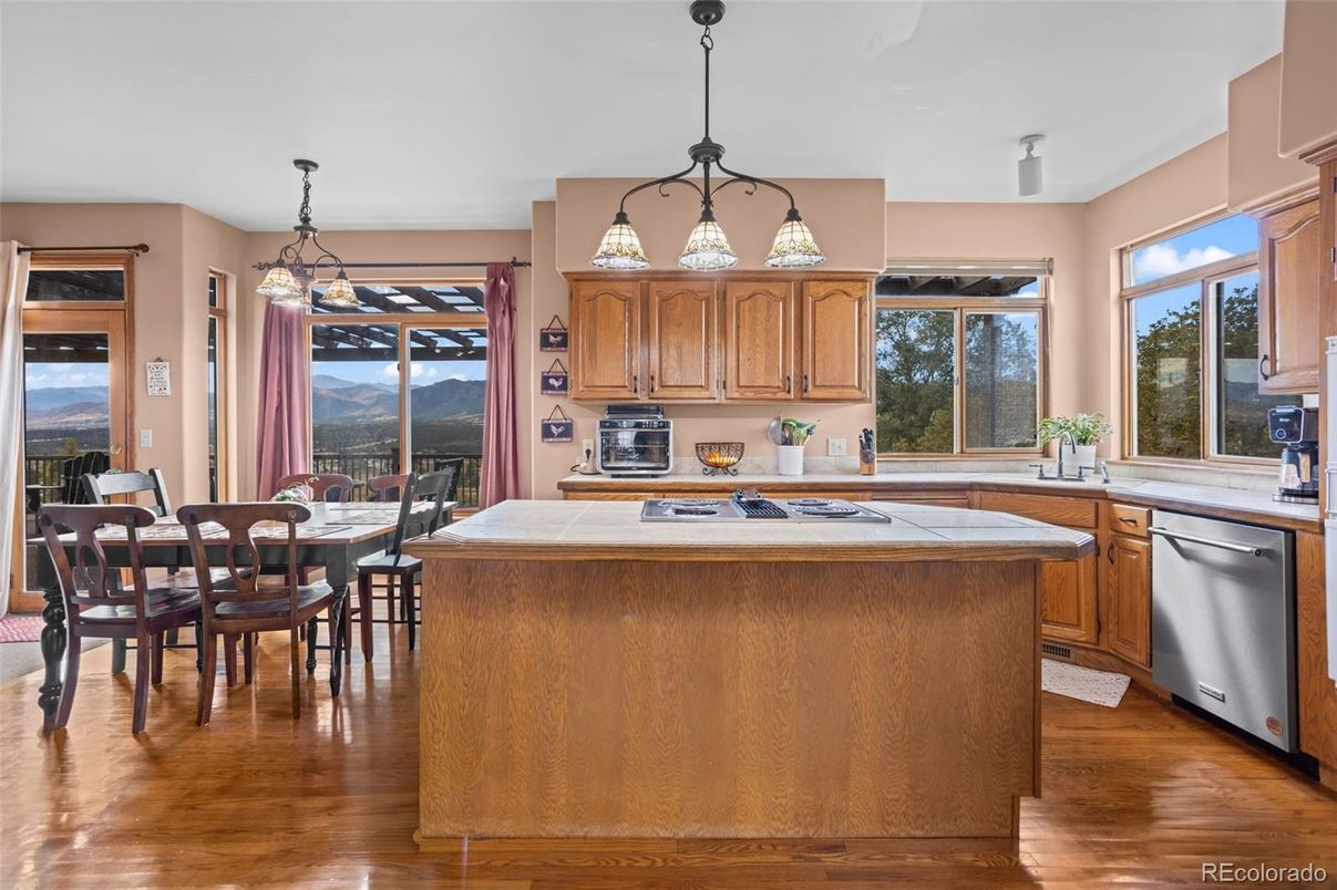 Dining room, Interior, Kitchen, Pendant Lights, Tile Countertops, Wood Texture Flooring